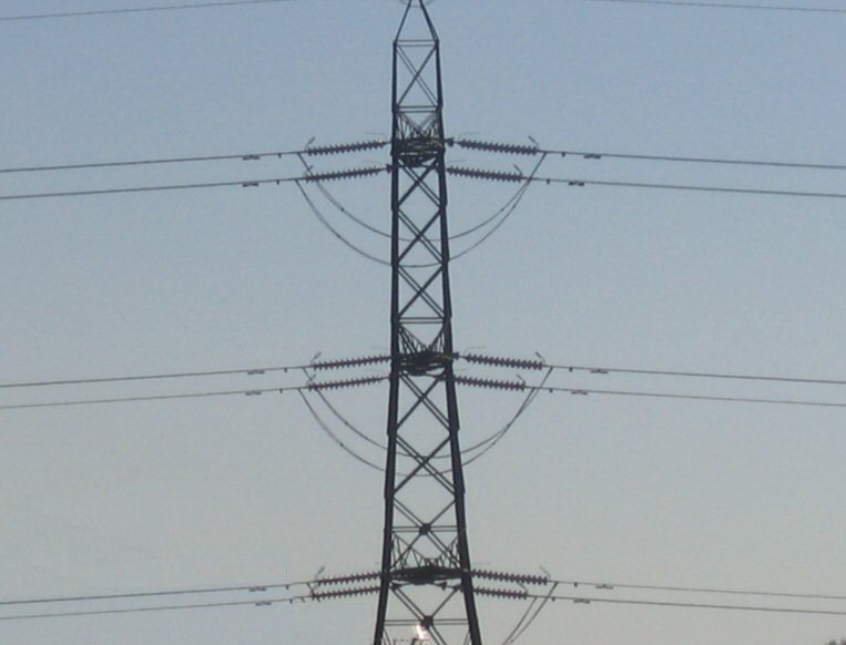 a phone pole with an alarm displayed behind it