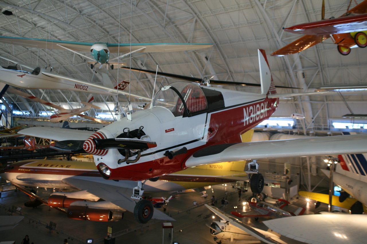 some old airplanes hanging from the ceiling in a hanger