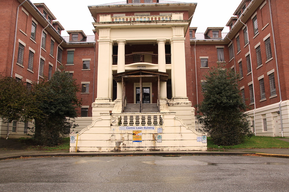 a building with stairs and columns in front of it