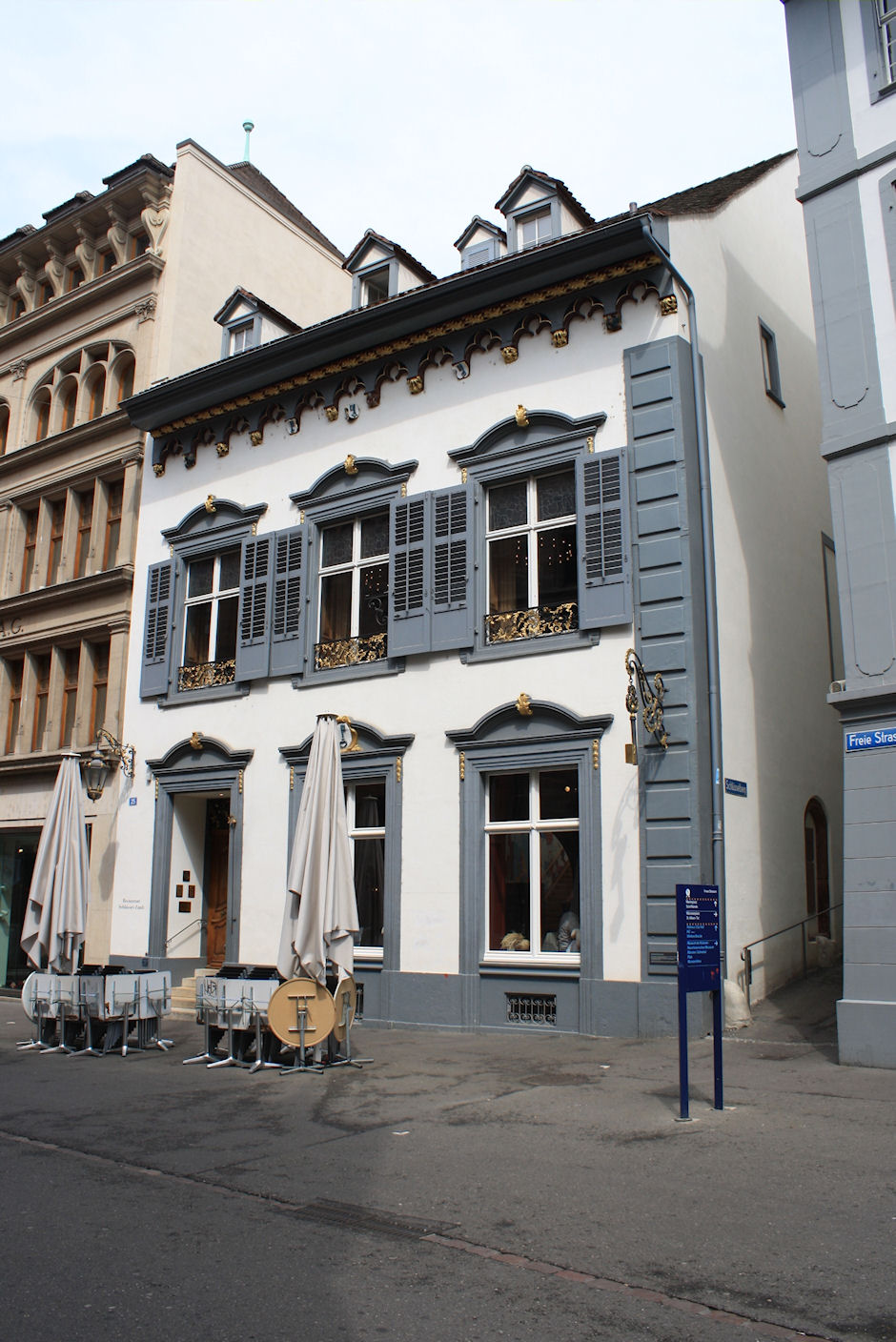 a city street with buildings that look like old houses