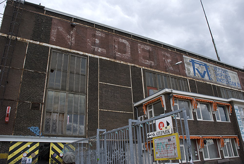 a large building with signs on the side