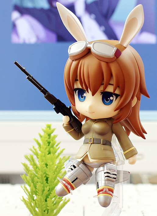 a figurine with big eyes, dressed as bunny girl