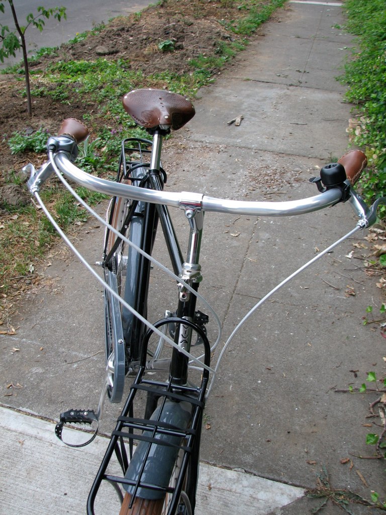 a bicycle that is parked by the side of a street