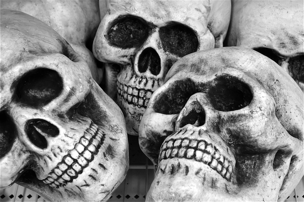 black and white pograph of skulls made from concrete