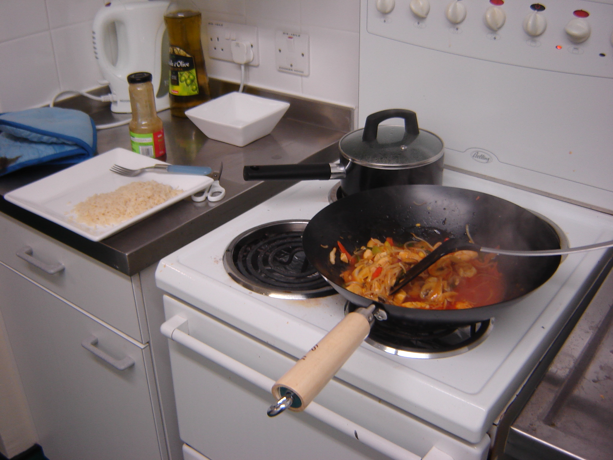 a stovetop with food on it next to a set