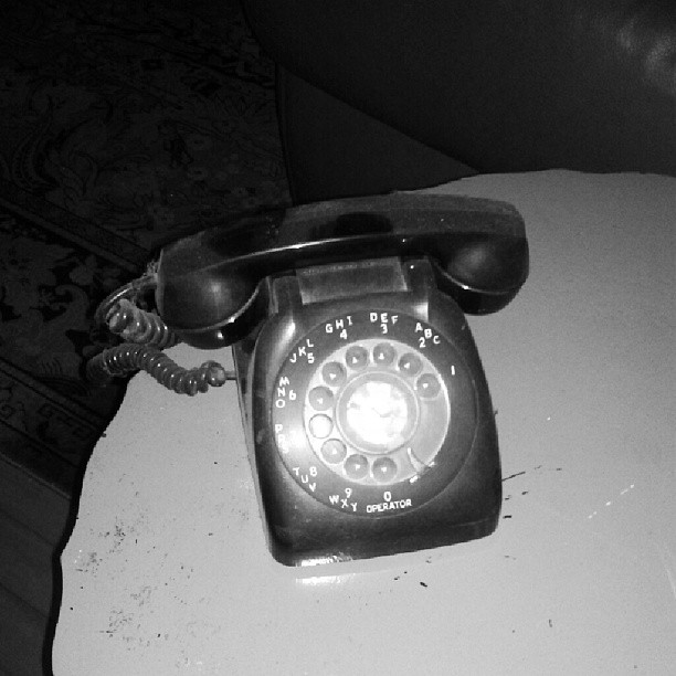 an old fashioned phone on top of a table