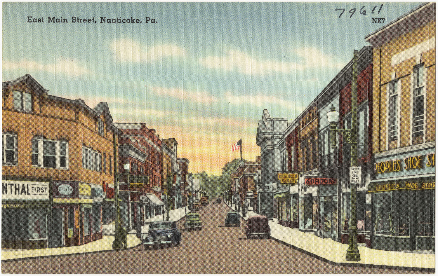 an old time picture of a small town with cars driving down the street