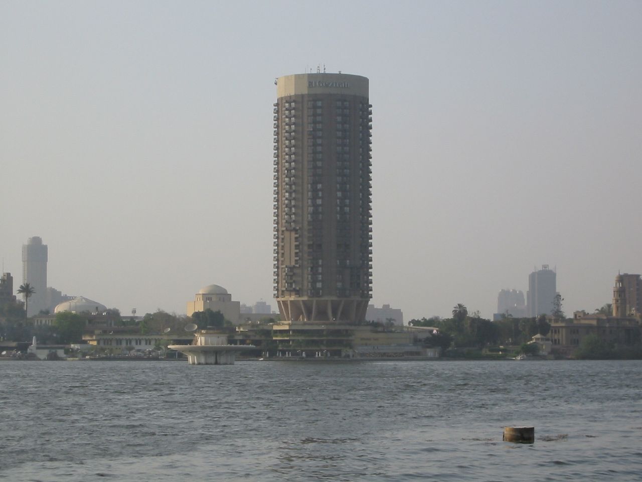 a tall tower that is in the middle of a body of water