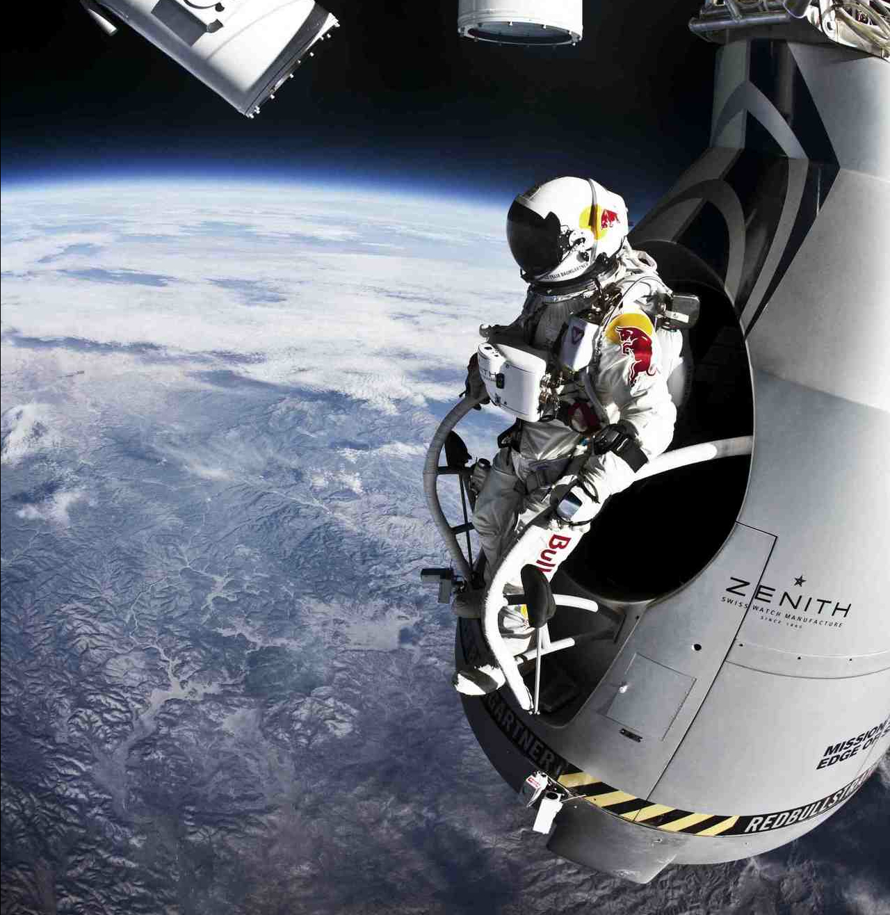 a spaceman is being watched by the other astronauts