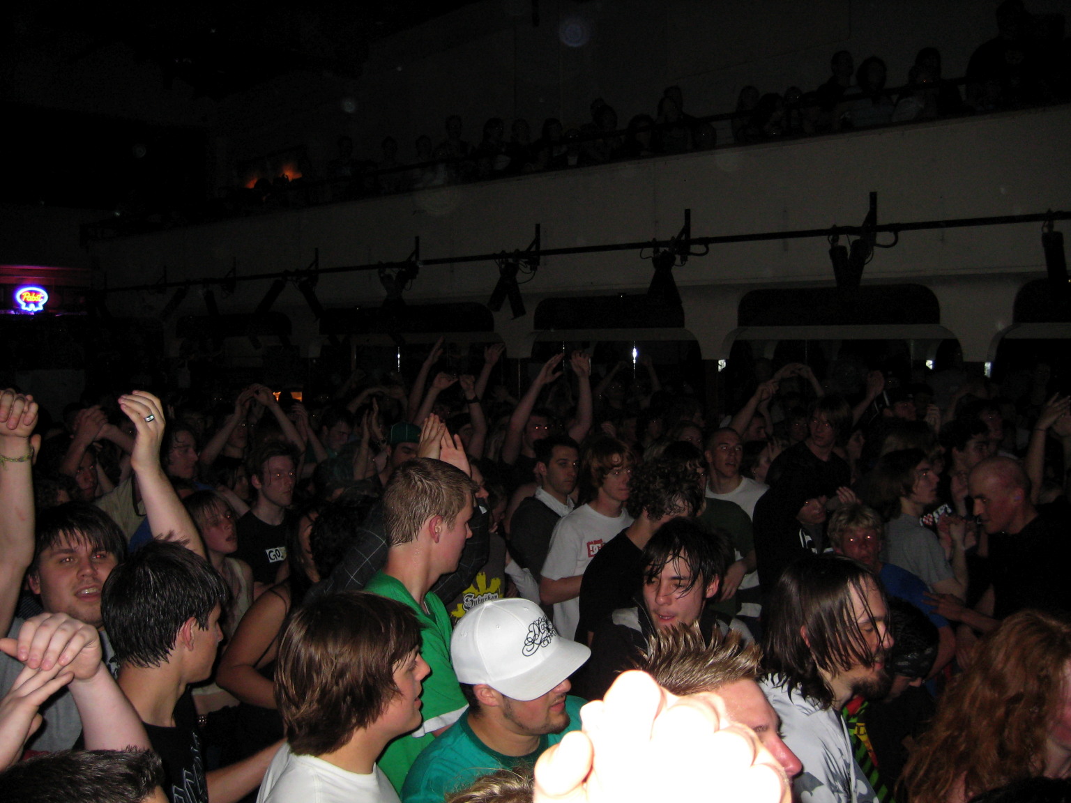 a large crowd in a crowded room at an event