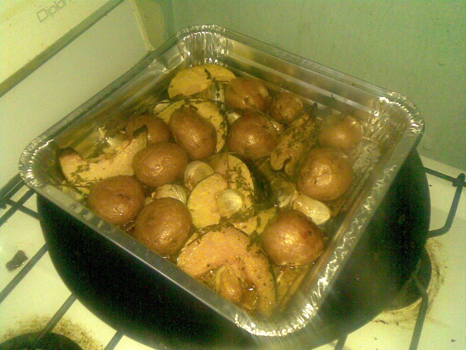 a pan filled with food sitting on top of a stove