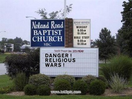 two signs advertising church with words about religion