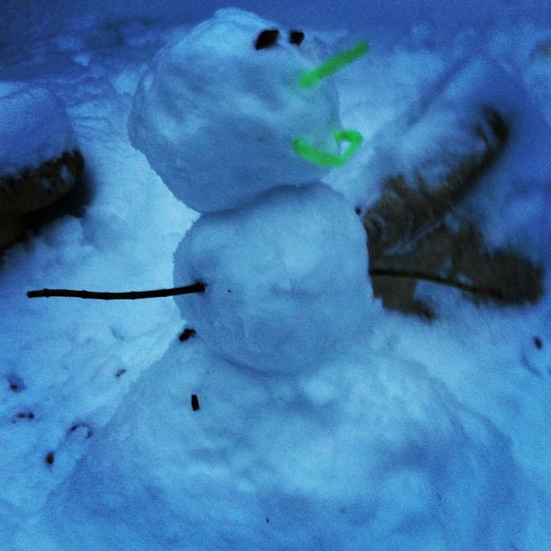 there is a snow man that is in the dark