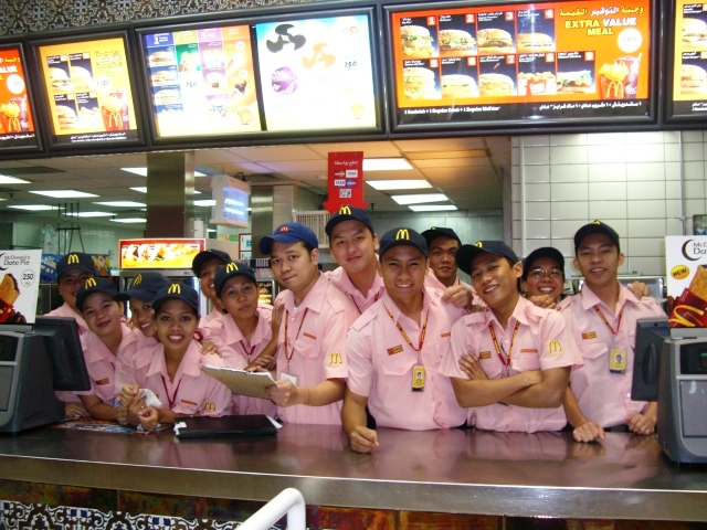 a group of uniformed people are posing for a po