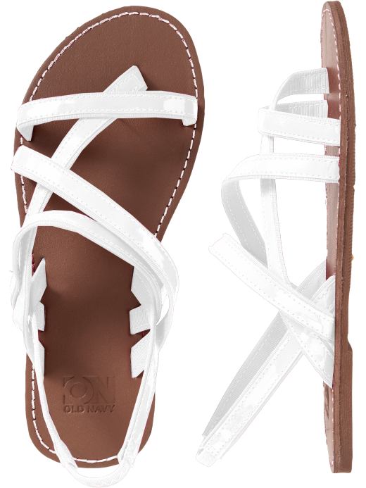 the women's white sandals are tied together and ready for your next trip