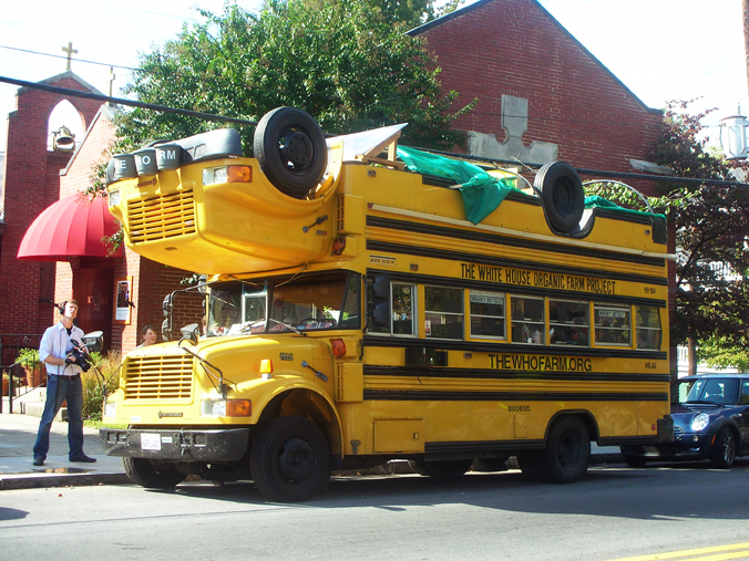 the yellow school bus is on the side of the road