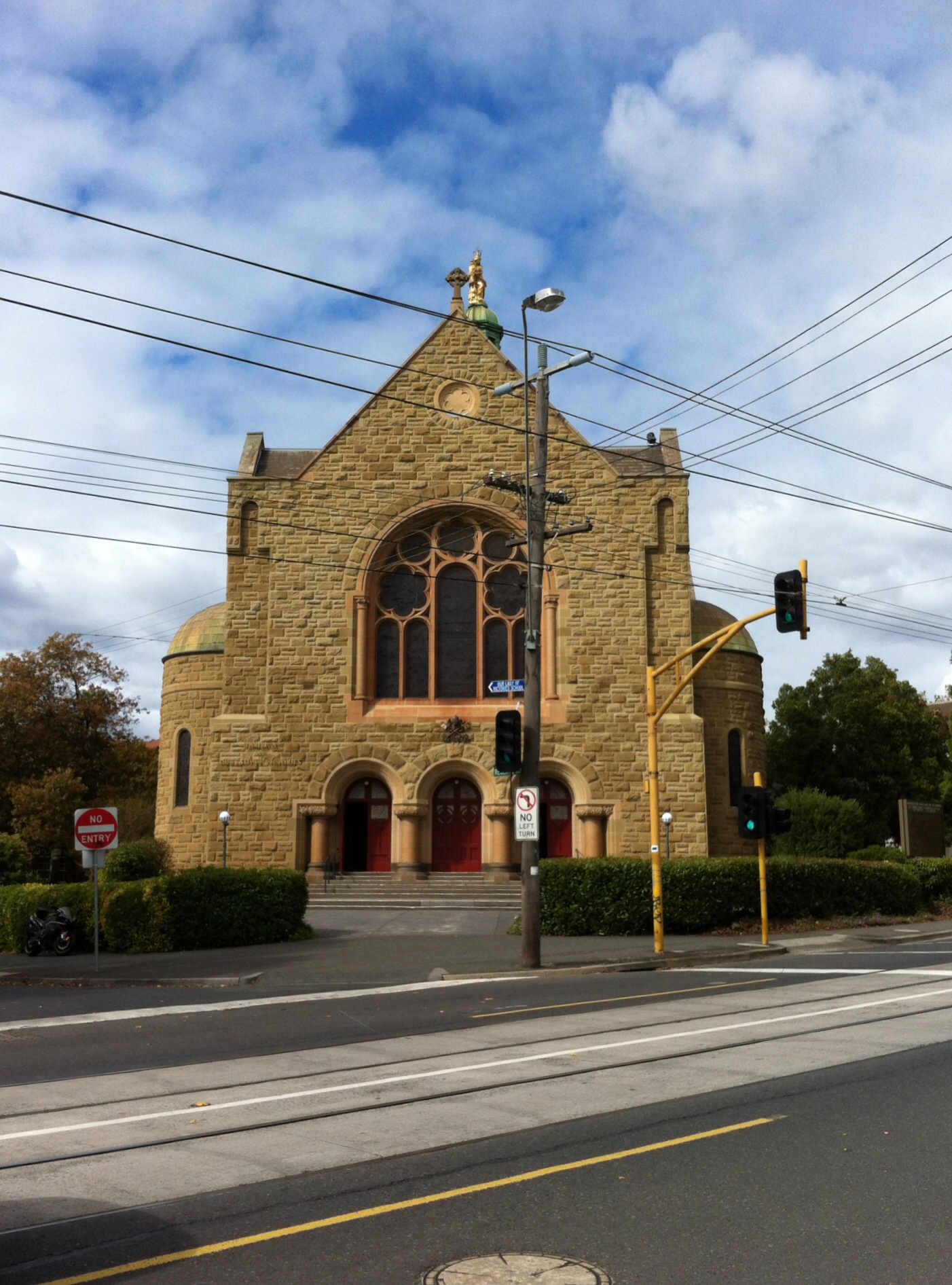 a church with an old stone front in the day