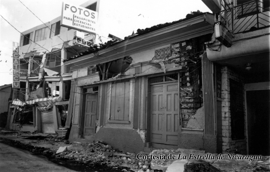 an old po with a large building and broken down doors