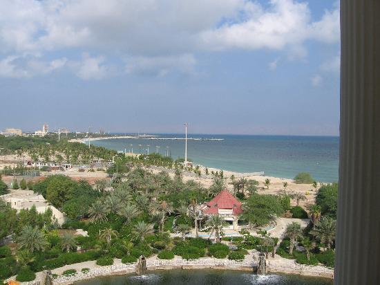 a view from a window looking at a beach with houses