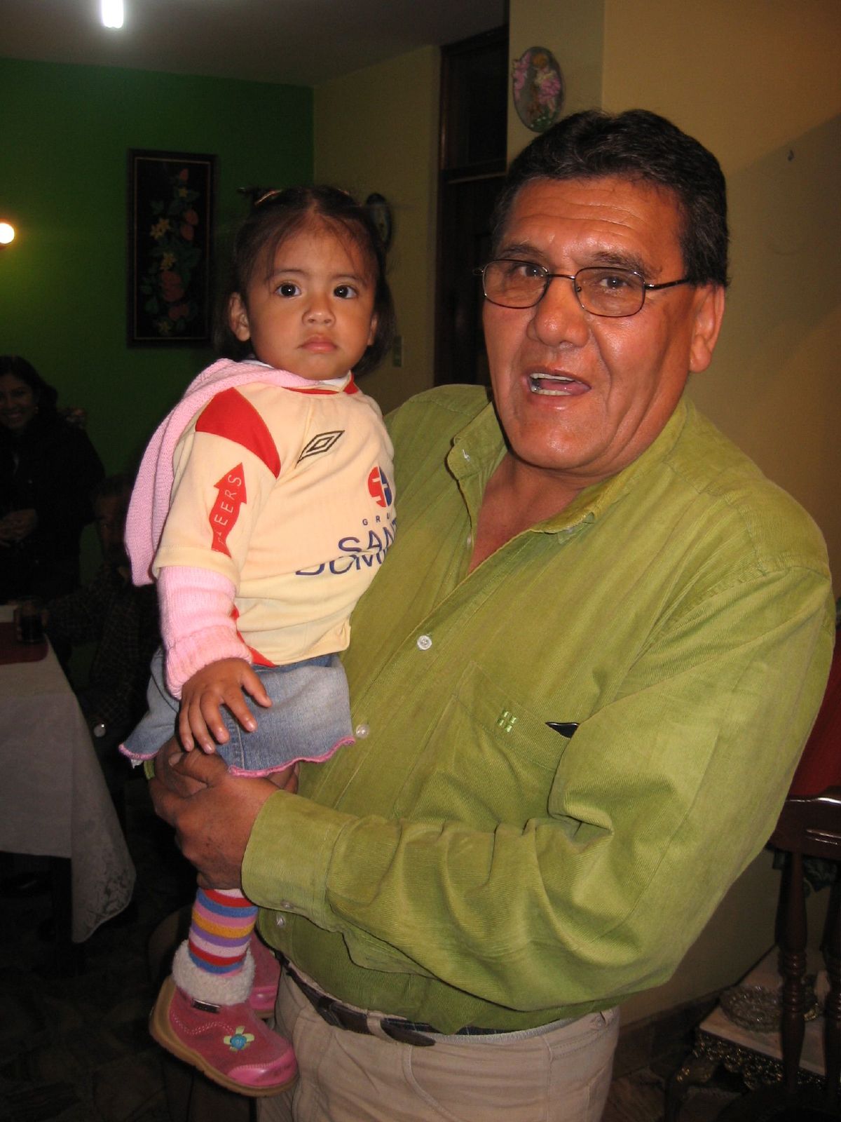 man holding a small child in his arms