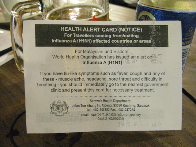an information sign about health alert cards