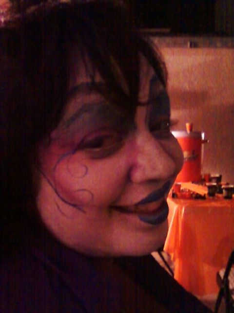 a person with face paint making a funny face