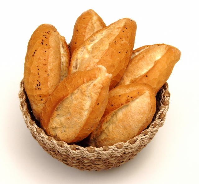 bread is in the basket with a white background