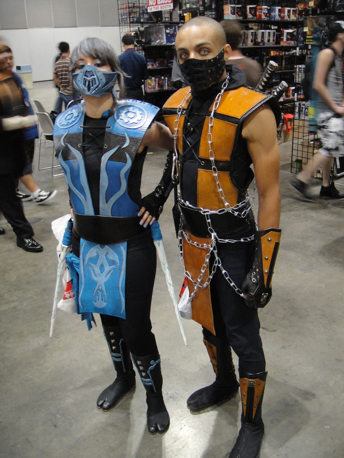 two people dressed in costumes stand next to each other