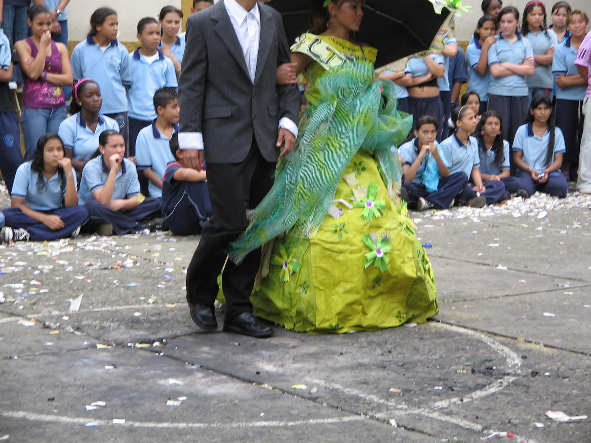 people watch a man and woman perform on the stage