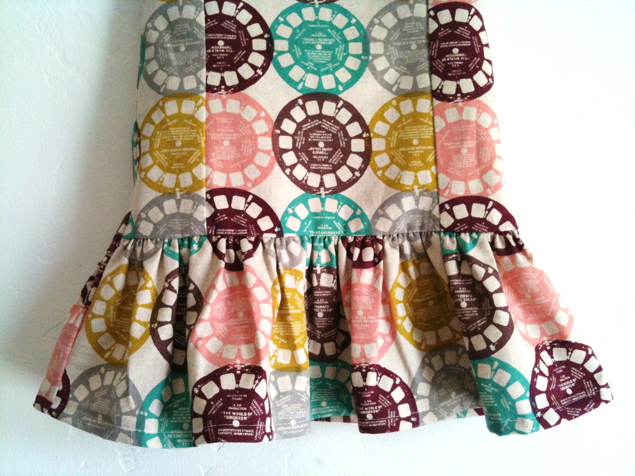 a colorful skirt with circular design hanging from it