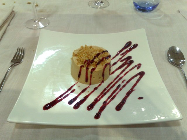 a small dessert on a white plate on a table