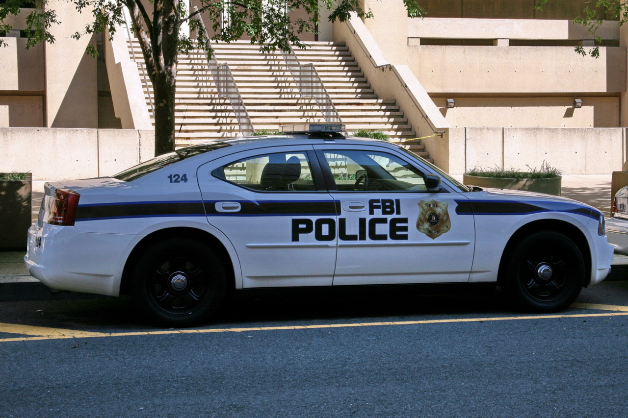 a police car is parked in front of a building