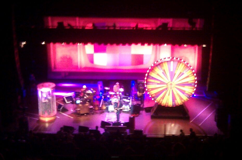 the stage is lit up with purple and red lighting