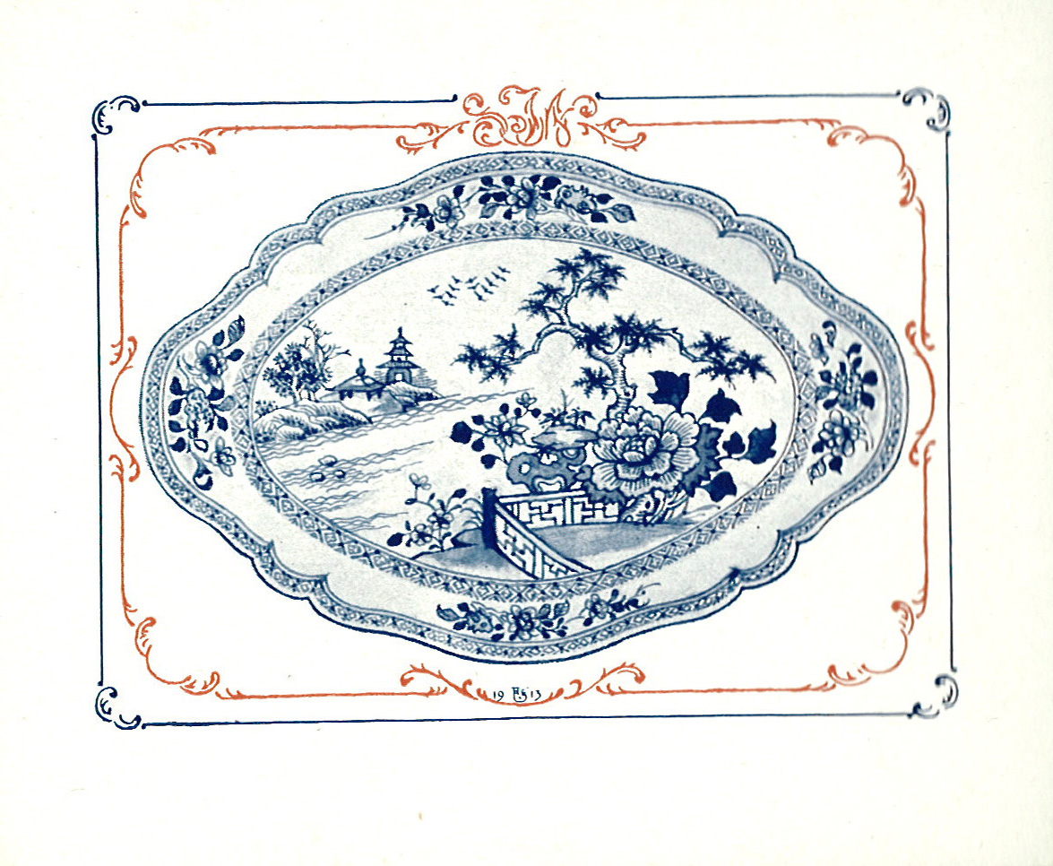 an ornate blue and white platter on white paper