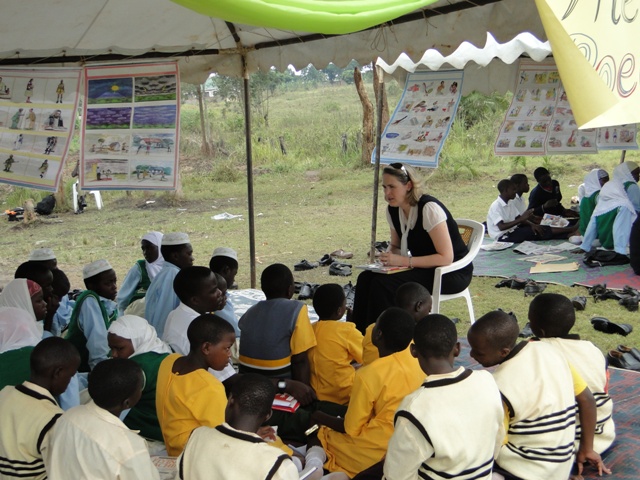 the girls sit under the tents reading to s