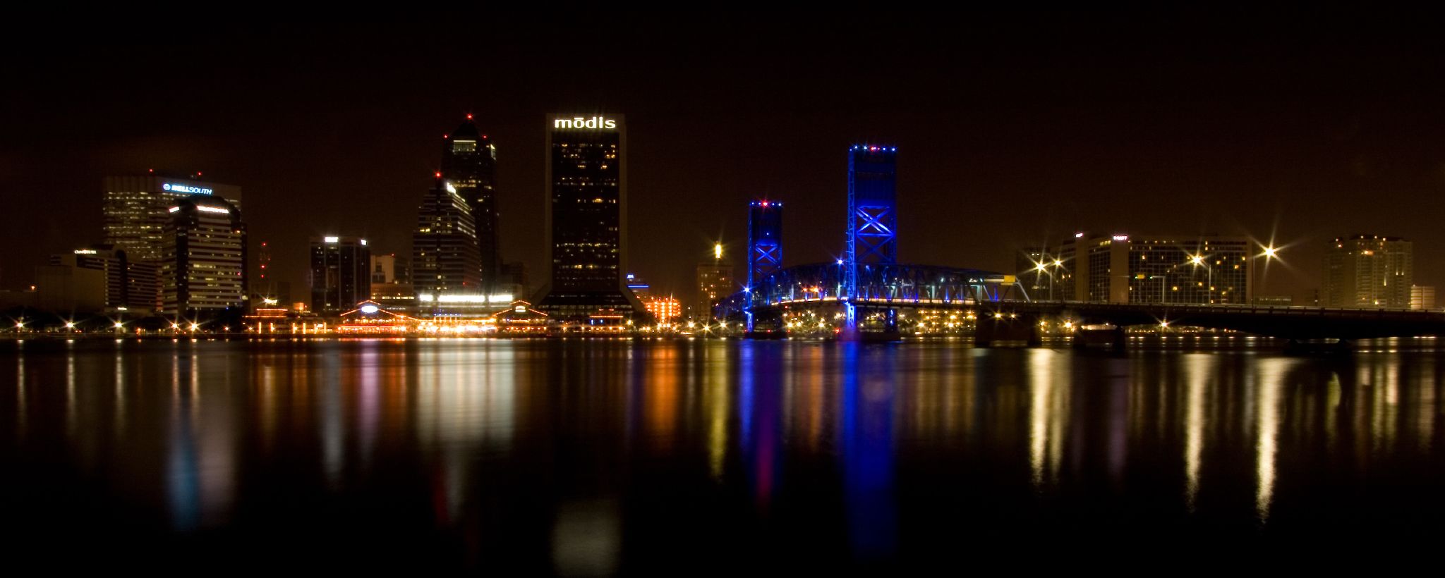 a nighttime view of a city from across the river