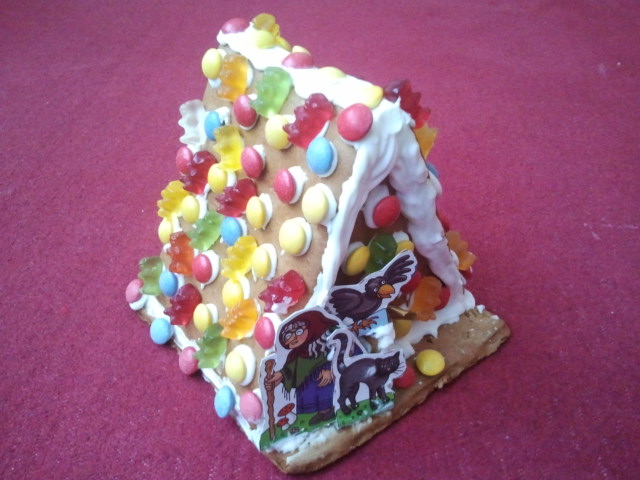 this is a po of a close up of a gingerbread house with candy on it