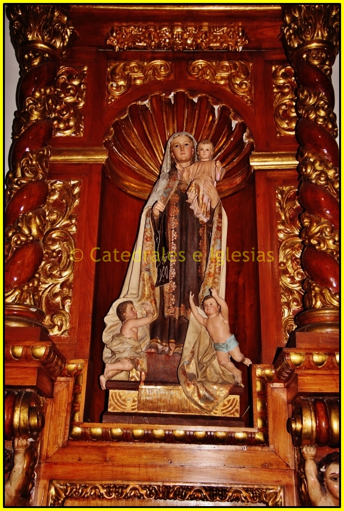 the statue of mother mary is made of wood