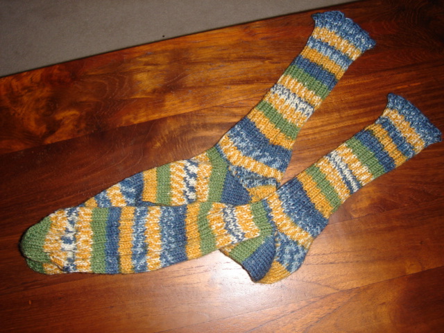 socks made out of knit on a wooden table