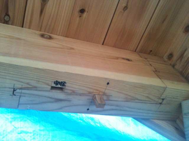 a close up of a wood structure with many holes