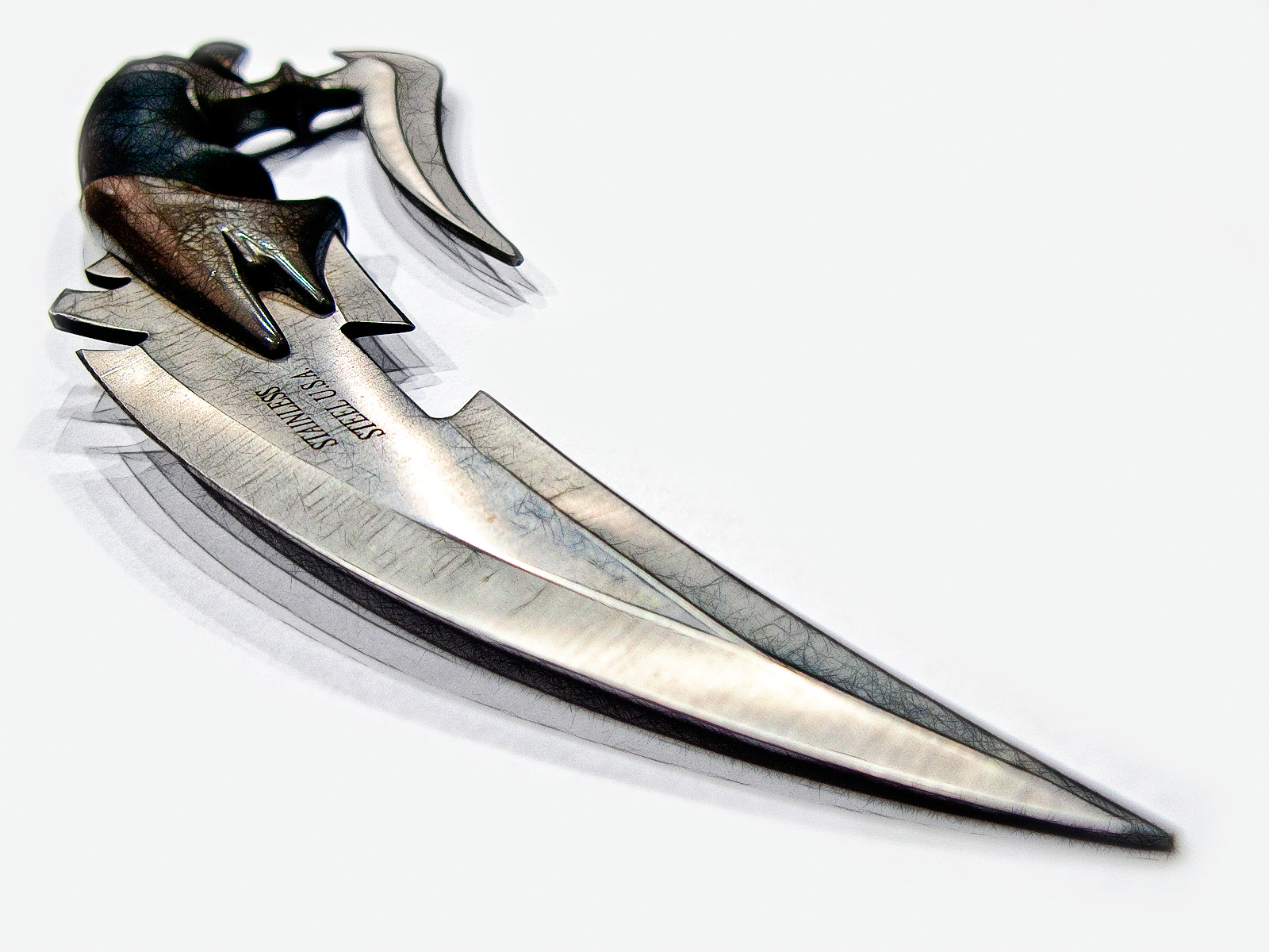 a set of four knives with the top part open