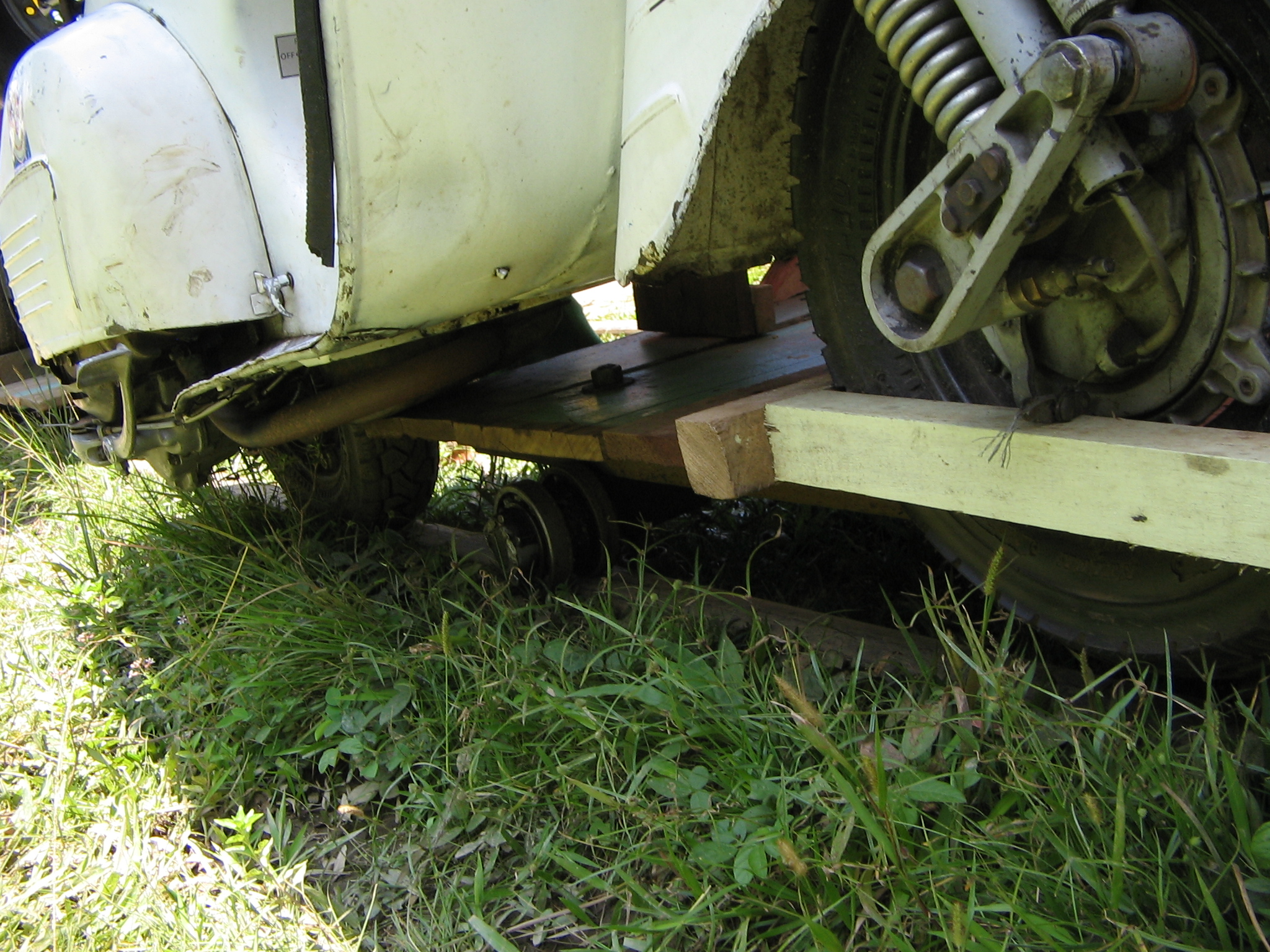 the front wheels of a vehicle with two separate rear wheels that are partially turned slightly