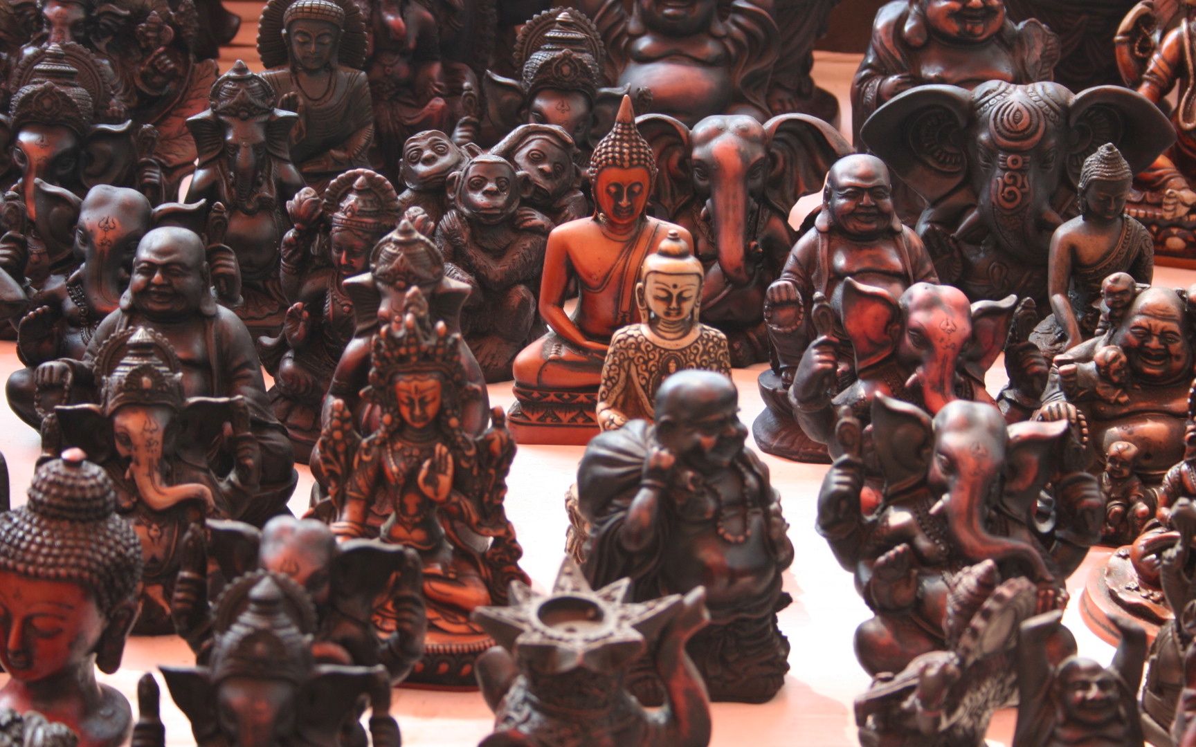 a pile of decorative ceramic statues on display