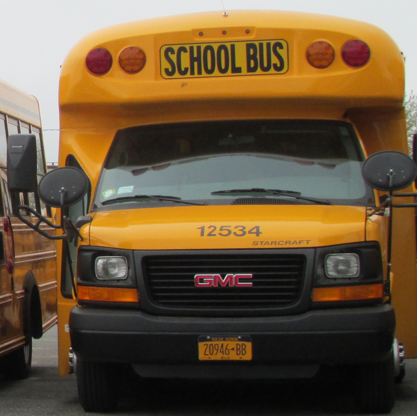 an image of two school buses that are parked