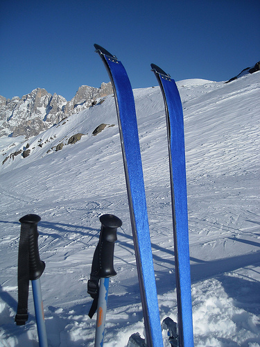 a pair of skis on top of snow covered ground