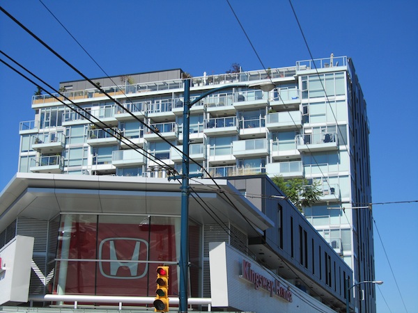 an image of building with signage on side of street