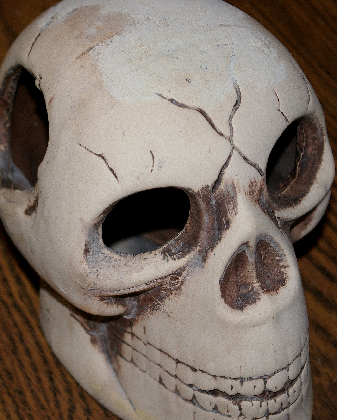 a po of a white skull with multiple holes