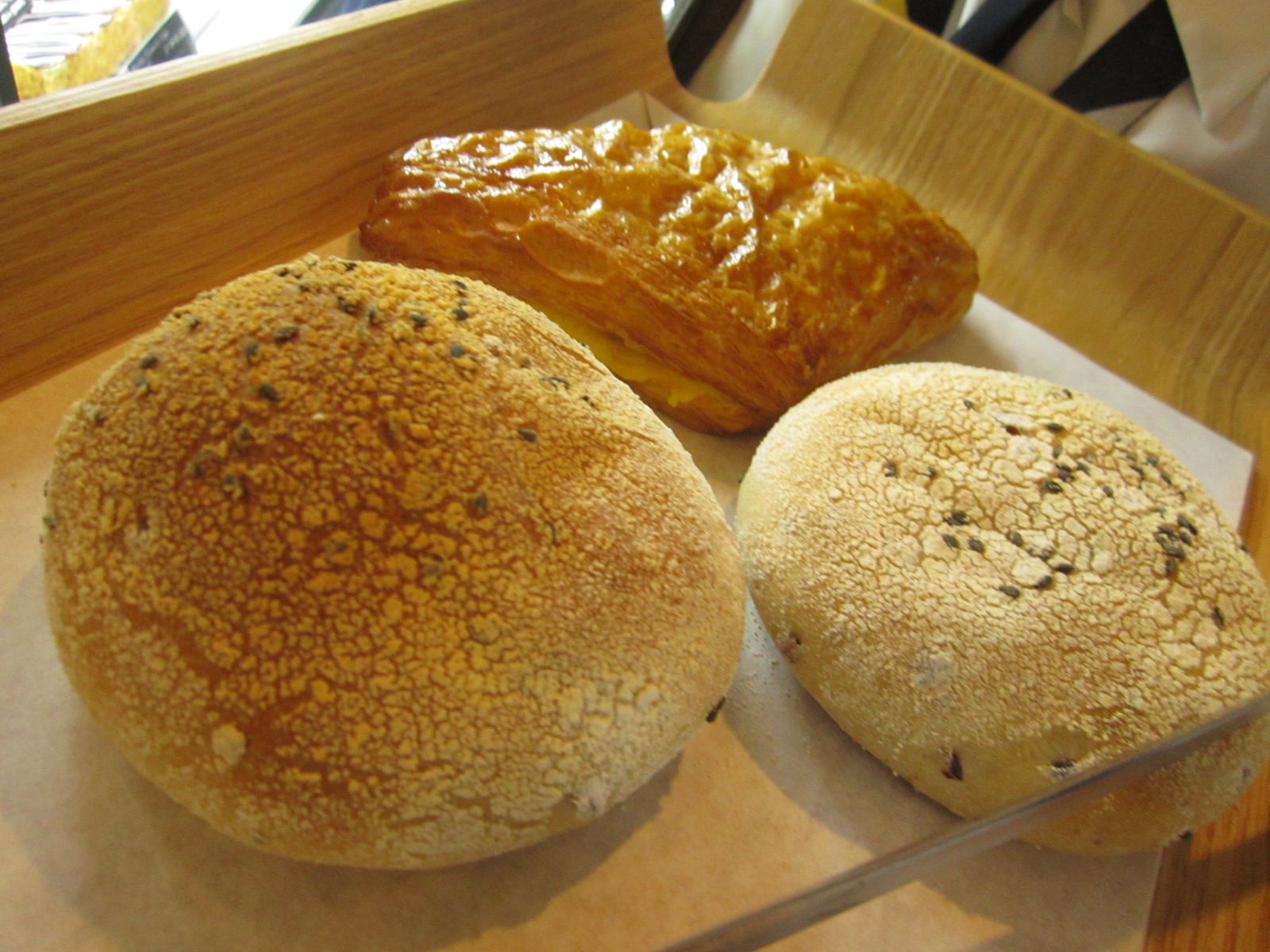 two round breads sitting next to each other on top of a counter