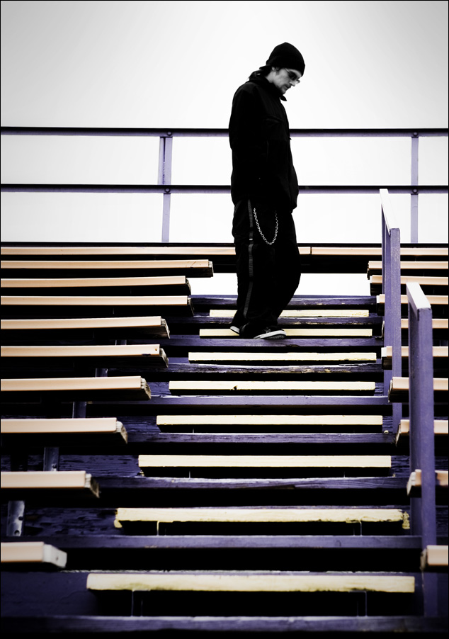 a man walking up and down steps at an indoor stadium