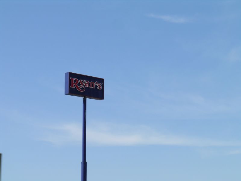 a sign is displayed on the front of a restaurant
